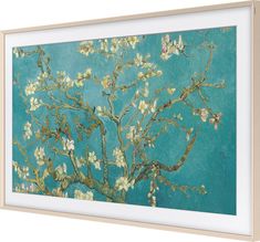 an art print on the wall of a tree with white flowers against a blue background