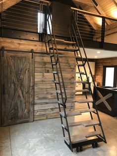 a set of stairs leading up to a loft