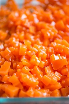 chopped up carrots are in a glass dish