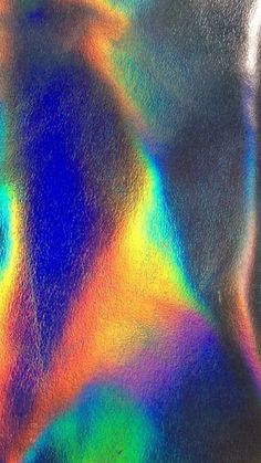 an abstract image of a woman's face and neck in multicolored paint