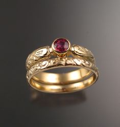 "This pretty ring set has a Victorian antique look with a 4mm round natural Orange Sapphire from Ceylon. Set in 14k Yellow Gold The band is 4mm wide and 1.5mm thick. The matching band is 2.5mm wide and 1.3mm thick The color of these stones ranges from fire orange to pink orange as shown in the last picture. Specify your size and color preference in a \"note to seller\" at check out." Padparadscha Sapphire Ring, Purple Sapphire Ring, Sapphire Wedding Rings, Padparadscha Sapphire, Gold Rings Jewelry, Gold Ring Designs, Sapphire Wedding, Victorian Rings, Orange Sapphire