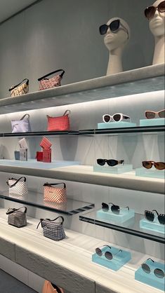 the display case is full of sunglasses and purses