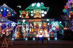 a house covered in christmas lights at night