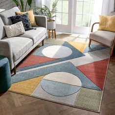 a living room filled with furniture and a rug