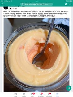 a spoon is in a bowl filled with cream and orange sauce, which has been shared on instagram