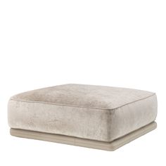 a large square ottoman with a cushion on the top and bottom, in light grey velvet