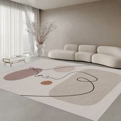 a living room with white couches and rugs