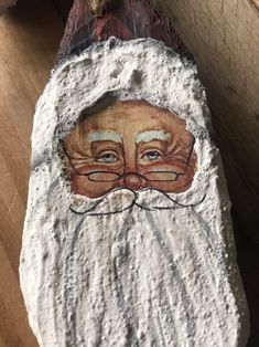 a stone with a face painted on it