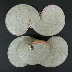 three gray and pink pads on top of each other with zippers attached to them