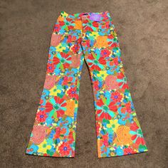 You Will Definitely Turn Heads In These Fabulous Pants! They’re A Bright Floral Pattern With A Wide Flare Leg. I Absolutely Love These But Are Too Big. Waist 15 Inches Inseam 34 Inches Rise 7 Inches Retro Wide Leg Bottoms With Floral Print, Retro Wide Leg Floral Bottoms, Vibrant Wide Leg Spring Pants, Vibrant Wide Leg Pants For Spring, Retro Wide Leg Pants With Floral Print, Casual Wide Leg Pants With Retro Print, High Waist Colorful Bottoms For Spring, High-waisted Colorful Bottoms For Spring, Colorful High-waist Bottoms For Spring