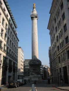 the monument is surrounded by tall buildings