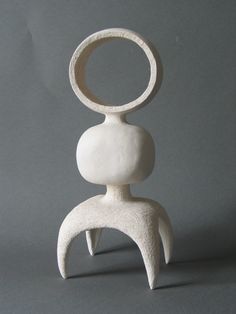 a white sculpture sitting on top of a table