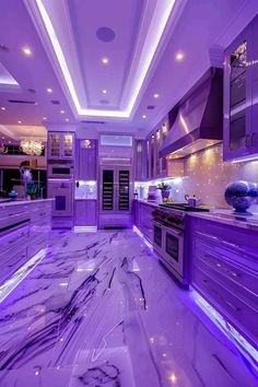 a kitchen with purple lighting and marble counter tops