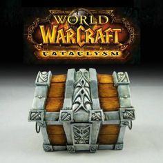 a wooden chest sitting on top of a table next to a sign that says world of warcraft cataclysm