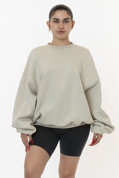 This oversized cotton crewneck is made of a bouncy 12 oz. cotton fleece and has a voluminous, wide fit. This pullover features a high crew neckline and matching rib cuffs. We recommend sizing up for an even more oversized look. Try pairing this sweatshirt with bike shorts or our matching sweatpants. This fleece is made Neutral Crop Tops, Colored Sweatpants, Womens Oversized Sweatshirts, Cotton Sweatpants, Oversized Crewneck, Sweater Fits, Sweatshirt For Women, High Waist Fashion, Sweatshirt Outfit