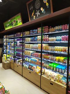 a grocery store filled with lots of food and drinks on display in front of the shelves