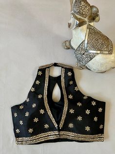 Black halter neck blouse with blouse kundan stone work Cheap Zari Weaving Blouse Piece For Festivals, Black Halter Neck Blouse, Halter Neck Blouse Back, Halter Neck Blouse Design, Ruffle Blouse Designs, Exclusive Blouse Designs, Navratri Outfits, Diwali 2024, Halter Neck Blouse