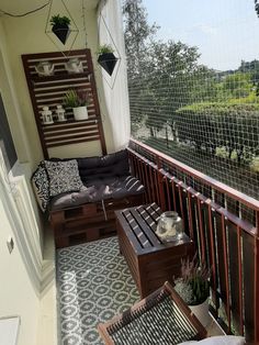 the balcony is decorated with wooden furniture and plants