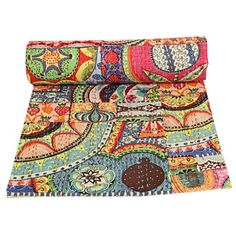 a multicolored paisley print rug with an intricate design on the bottom and sides