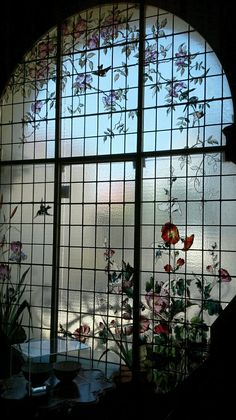 a round window that has flowers on it