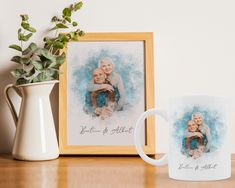 two mugs sitting on a table next to a vase with a plant in it