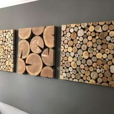 three pieces of wood are hanging on the wall