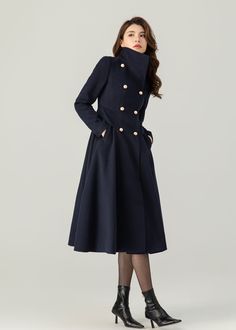 "FEATURES 50% wool, 50% wool blend Fully liner with polyester  With pockets Lapel collar or you can wear it stand up Long sleeve Button closure in front Fitted waist For Winter, Autumn Navy blue wool coat Double breasted wool coat dry clean ★★Mode size Height 170cm (5′ 7″)  Bust 84 cm (33\")  Waist 66 cm (26\")  She wears size XS. ★★Bespoke Order Service If you Request other color Request the length Your height is not between 155 cm- 175 cm Your weight is not between 47 kg -77 kg I can do it for Luxury Blue Peacoat With Button Closure, Luxury Navy Wool Peacoat, Luxury Navy Outerwear For Cold Weather, Luxury Blue Peacoat With Buttons, Luxury Winter Pea Coat With Double Button Closure, Coat With Uniform Uk, Luxury Navy Pea Coat With Lapel Collar, Luxury Navy Pea Coat With Double Button Closure, Luxury Elegant Peacoat With Double Button Closure