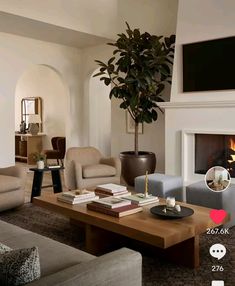 a living room filled with furniture and a fire place next to a tv mounted on the wall