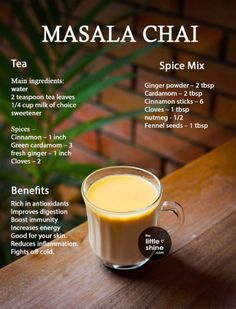 a cup of masala chai on top of a wooden table