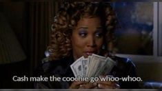 a woman holding cash in her hands with the words cash make the cookie go who - who?