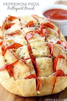 pepperoni pizza pull apart bread on a cutting board