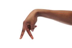 a person's hand pointing at something on a white background