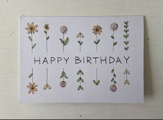 a happy birthday card with flowers on it