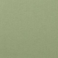 an image of a plain green fabric textured with some sort of cloth on it