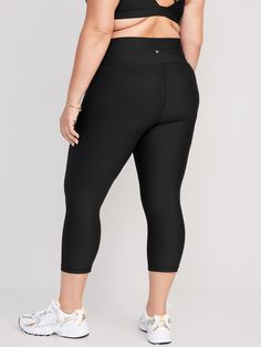 elasticized waist breathable go-dry wicks moisture sits at belly button fitted hits mid-calf 21" inseam models are approx.  5'9" and wear sizes s (4), l (12), and xl (18)machine wash according to the care instruction label Black Gym Bottoms With 5-inch Inseam, Black Running Bottoms With 5-inch Inseam, Compression Activewear With Elastic Waistband, Hip-length, Black Yoga Pants With 5-inch Inseam For Gym, Casual Black Go-dry Leggings, Black Activewear With 5-inch Inseam For Gym, Gym Bottoms With 4-way Stretch In Capri Length, Gym Capri-length Bottoms With 4-way Stretch, Black Compression Moisture-wicking Bottoms