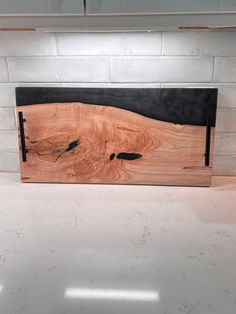 a piece of wood that is sitting on a counter