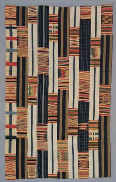 a multicolored patchwork rug with stripes on it