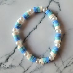 Beautiful beaded bracelet handmade by me. Durable, strong, flexible and stretchy. Fits all. Bracelet Ideas Clay Beads, Pearl Bracelet Ideas, Clay Beads Ideas, Bracelets Preppy, Light Blue Bracelet, Clay Beaded Bracelet, Make Clay Beads, Preppy Bracelets, Beautiful Beaded Bracelet