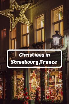 christmas in strasburg, france at night with lights and decorations on the windows