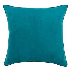 a teal green pillow on a white background