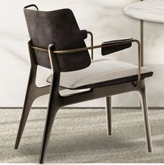 a chair that is sitting next to a table