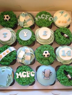 cupcakes in the shape of soccer balls and numbers are decorated with green grass