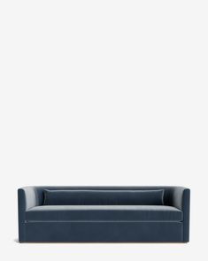 a blue couch against a white wall