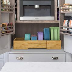 a kitchen with an oven, microwave and other items on the shelves in front of it