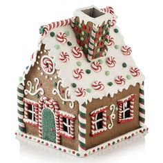 a gingerbread house is decorated with candy canes