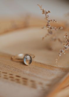 Our Dori ring is made with a gorgeous Labradorite stone. This mystical gemstone is believed to enhance mental clarity and bring about transformation. It's a crystal connected to the third eye chakra which is our gateway to inner wisdom and deeper intuition. 8mm round or 6x8mm oval labradorite stone. Ring band measures 1mm wide. Available in 14kt Gold Fill + Sterling Silver. Juliann stacks it with our Swell Ring and 2 Confetti Rings. KJ pairs it with our Sonder Ring, Raye Ring, and Confetti Ring. Confetti Rings, Confetti Ring, Everyday Wear Jewelry, Backdrops Necklace, Zodiac Rings, The Third Eye, Hoop Charms, Inner Wisdom, Wrap Ring