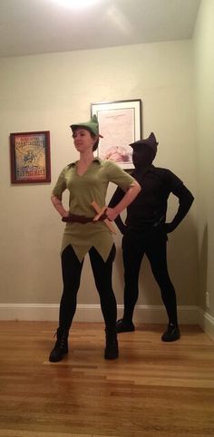 two people dressed up in costumes standing next to each other