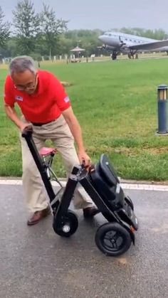 an older man pushing a cart with luggage on it