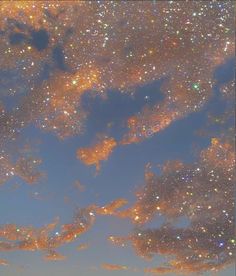 the sky is filled with stars and clouds