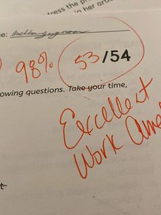 a piece of paper with writing on it that has been written in red and orange ink